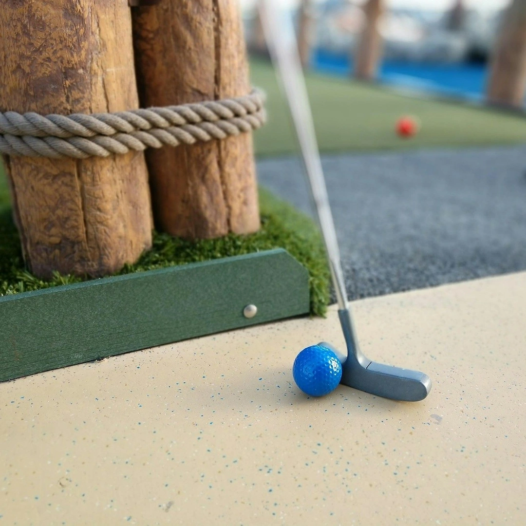 A crazy golf putter and golf ball