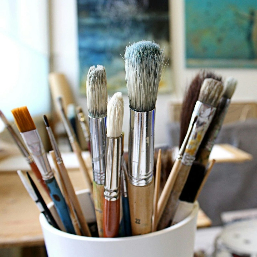 Paint brushes in an artist's studio